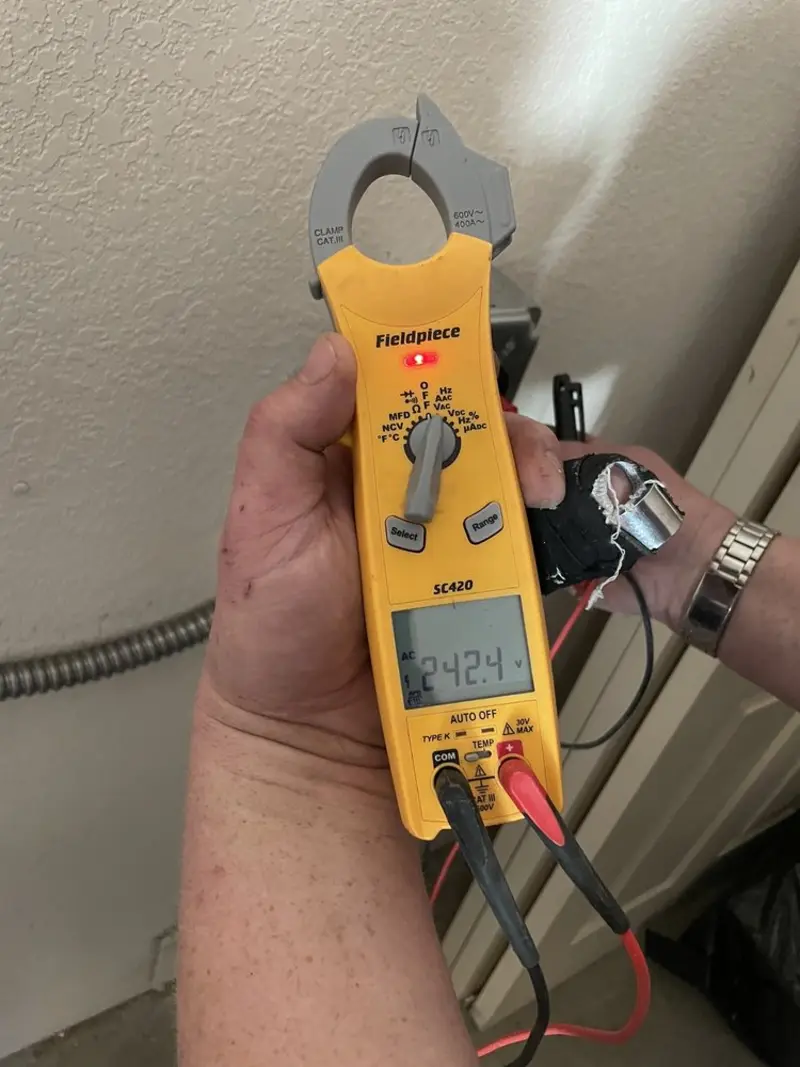 Voltage testing with clamp meter during Outlet Installation in El Granada